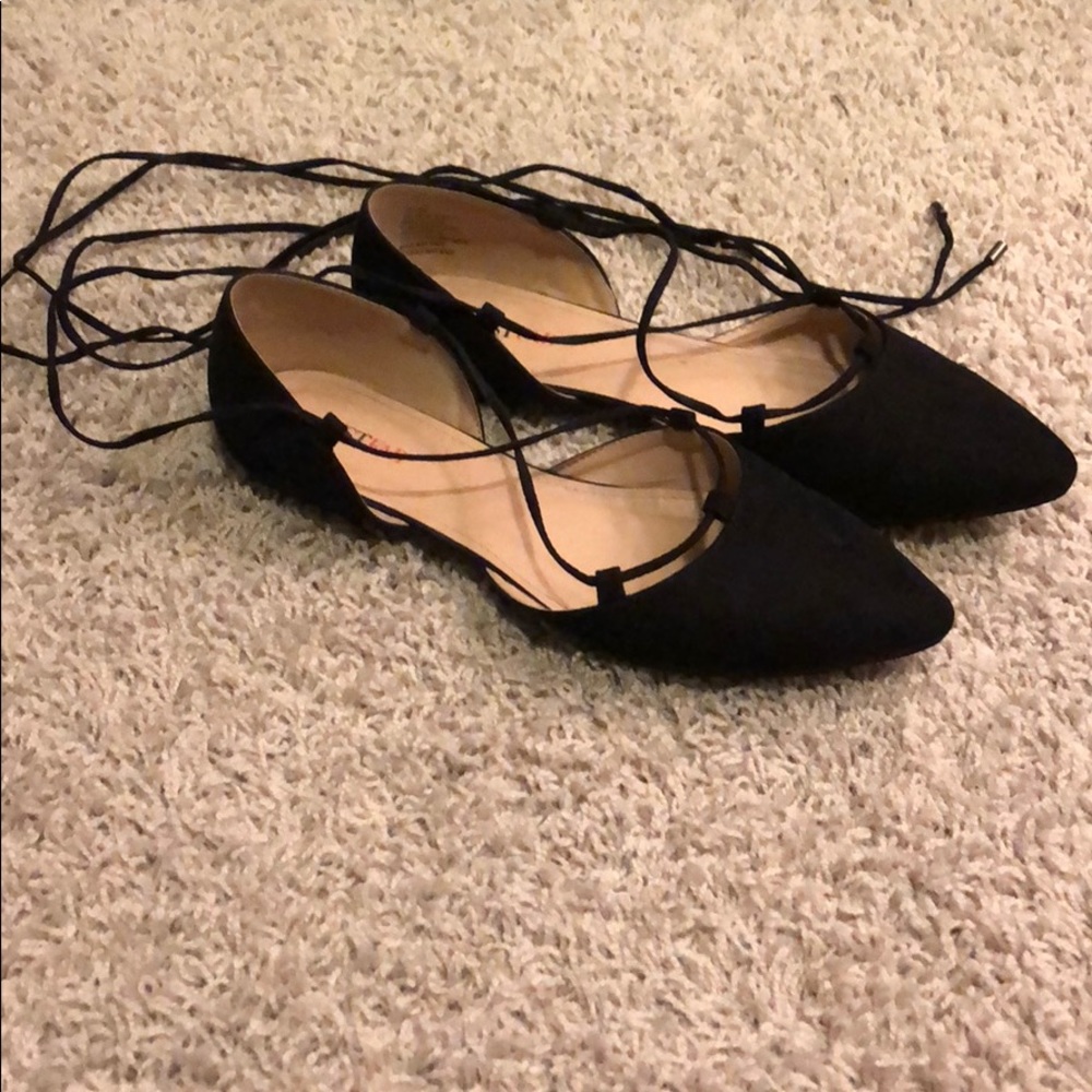 Black lace-up flats